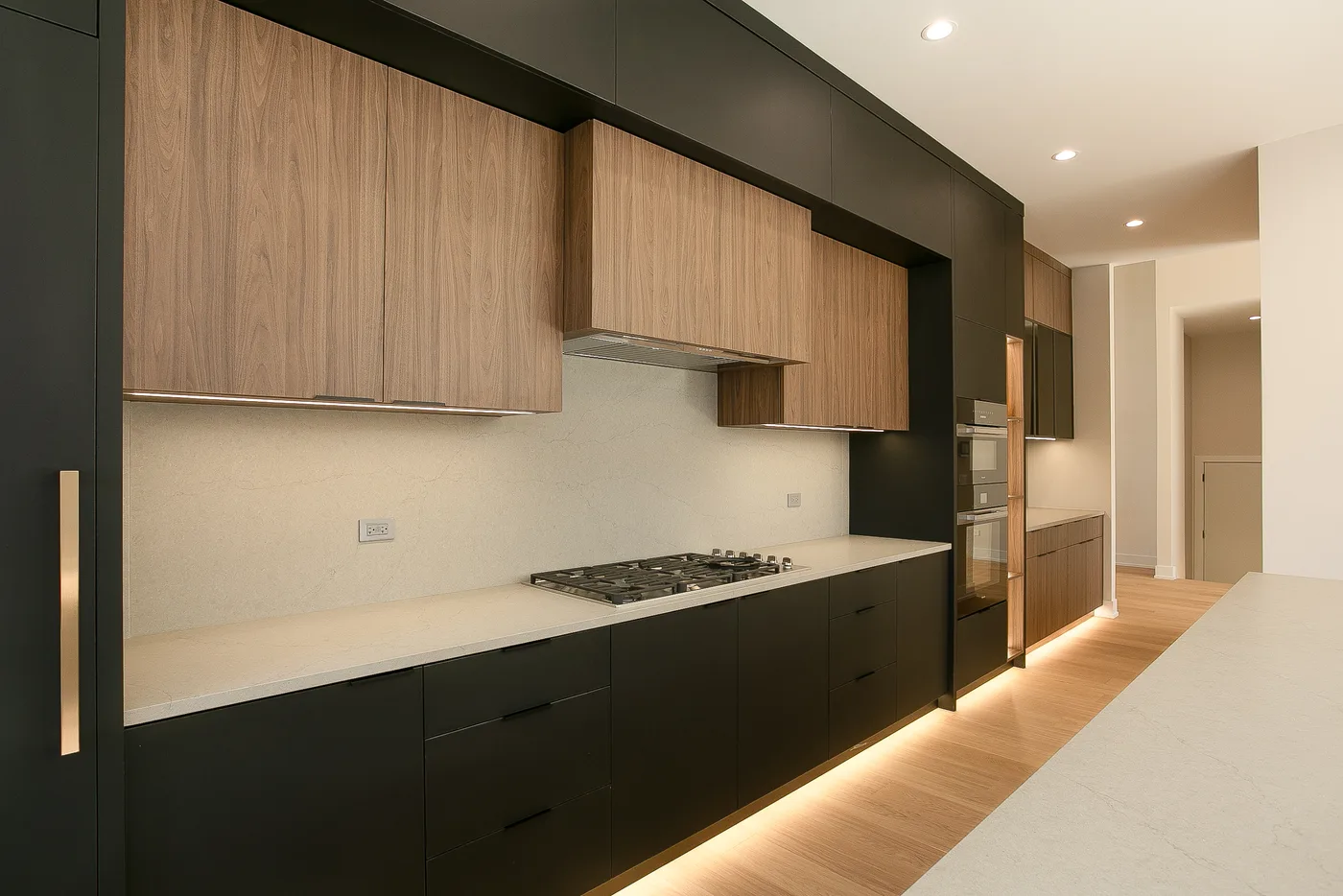 Wood-and-black kitchen cabinetry with integrated appliances - custom home, Lemont IL