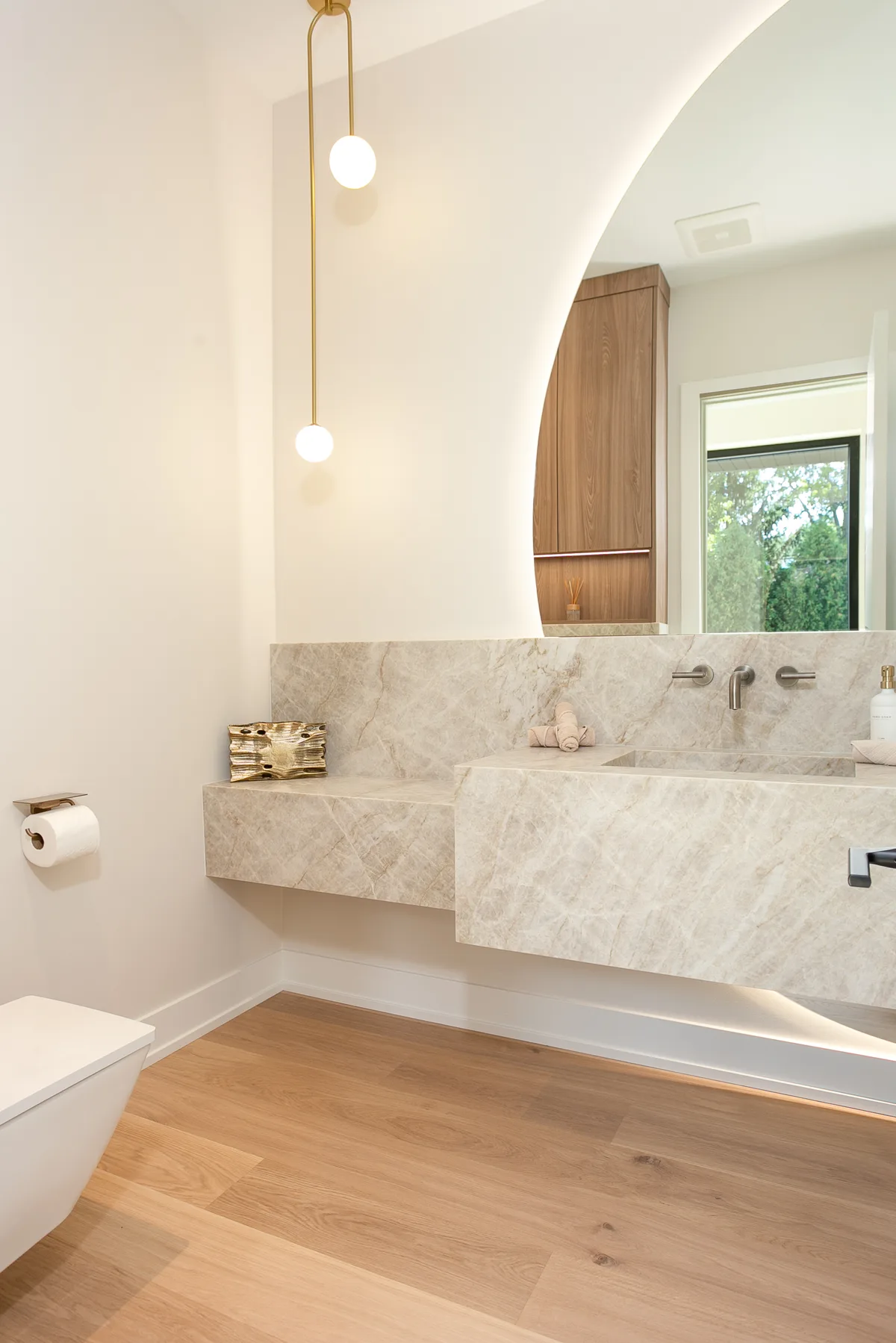 Floating stone vanity with a wall-mounted brushed-nickel faucet - custom home, Lemont IL